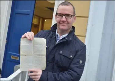  ?? Photo by Fergus Dennehy. ?? Kilfynn man John O’Mahony holds up a letter that is believed to have been penned from a French village near the front lines during the First World War by a Fr Jeremiah Galvan.The letter was found in the building that is now O’Mahony’s butchers in Listowel a number of years ago and is dated August 11, 1918.It is written to Jeremiah’s father.