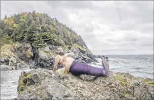  ?? THE CANADIAN PRESS/HO-AUBREY DAWE ?? William Whelan is shown in this undated handout image at Beach Cove in Portugal Cove, N.L., near St. John’s, N.L. for the 2018 Merb’ys calendar. They’re bearded, they’re burly and they’re wearing sparkly mermaid tails. A group of men posing as...