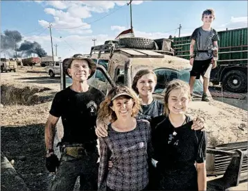  ?? FAMILY PHOTO ?? David and Karen Eubank are shown with their children Sahale, 16, Suuzanne, 14, and Peter, 11, in the Iraqi city of Mosul.