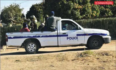  ??  ?? Police officers and soldiers on routine patrol around Njube high-density suburb in Bulawayo on Friday last week