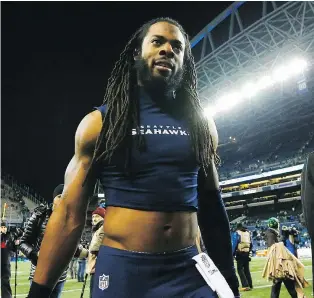  ?? — GETTY IMAGES FILES ?? Richard Sherman of the Seattle Seahawks leaves the field after the ’Hawks defeated the Detroit Lions 26-6 in the NFC wild card game at CenturyLin­k Field in Seattle on Saturday.