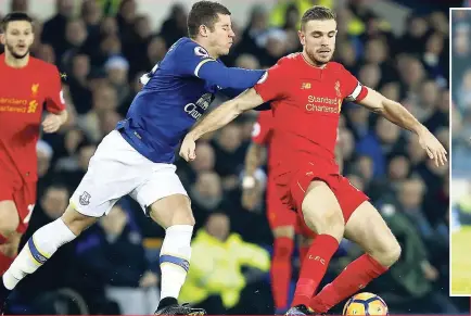  ??  ?? Liverpool’s Jordan Henderson (right) vies for the ball with Everton’s Ross Barkley during the English Premier League football match between Everton and Liverpool at Goodison Park stadium in Liverpool, England yesterday. Liverpool won 1-0.