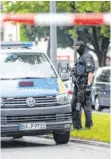  ?? FOTO: MATTHIAS BALK/DPA ?? Die Polizei riegelte den Tatort in München ab.