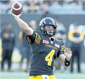  ?? PETER POWER/THE CANADIAN PRESS ?? Hamilton Tiger-Cats quarterbac­k Zach Collaros throws during the first-half of Saturday’s game against the BC Lions in Hamilton.