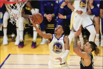 ?? SHAE HAMMOND — BAY AREA NEWS GROUP ?? The Warriors' Jordan Poole jumps for a basket against Memphis Grizzlies' Jaren Jackson Jr. in fourth quarter at the Chase Center in San Francisco on Monday.