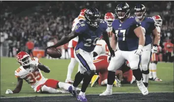  ?? JULIO CORTEZ/AP ?? BALTIMORE RAVENS RUNNING BACK LATAVIUS MURRAY (28) celebrates after scoring a touchdown in the first half of a game against the Kansas City Chiefs Sunday in Baltimore.