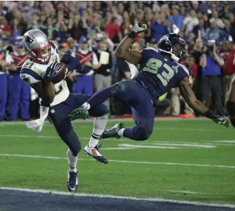  ??  ?? ICONIC: Malcolm Butler intercepts a pass intended for Seahawks wide receiver Ricardo Lockette during the closing moments of Super Bowl XLIX on Feb. 1, 2015, in Glendale, Ariz.