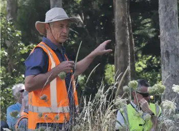  ?? PENNY WARDLE/STUFF ?? Paul Millen tells workshop delegates about a trial eucalypt planting, on a workshop visit to Marlboroug­h’s Pukaka Valley.