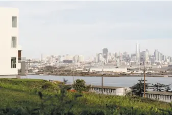  ?? Jessica Christian / The Chronicle ?? A new housing complex at the former Hunters Point Naval Shipyard offers stunning views of the S.F. skyline, but some homeowners worry there might be hazardous materials at the site.