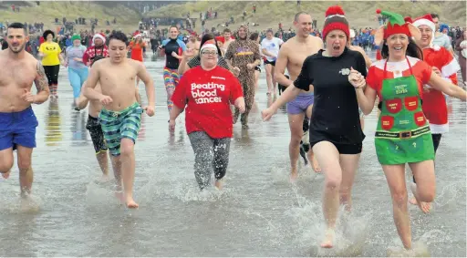  ?? Pictures: Jonathan Myers ?? The annual Walrus Dip at Pembrey.