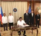  ??  ?? PRESIDENT Rodrigo R. Duterte signs Petroleum Service Contract No. 76 covering Area 4 in Eastern Palawan under the fifth Philippine Energy Contractin­g Round.