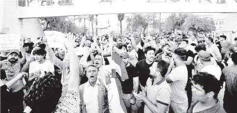  ?? — Reuters photo ?? Iraqi shout slogans during a protest in Baghdad, Iraq.