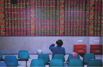  ?? Reuters ?? An investor at a brokerage house in Shanghai. The Shanghai Composite Index has been the worst performer among the world indices, registerin­g 15 per cent losses in the year so far.