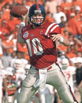  ?? COURTESY OLE MISS ATHLETICS ?? Former Ole Miss quarterbac­k Eli Manning throws at the 2004 Cotton Bowl.