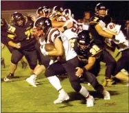  ?? Staff photograph by Mark Humphrey ?? Blackhawk senior Zaine Holley (No. 2) runs the football. The Blackhawks lost their first game of the season Friday to the Tigers, 42-21.