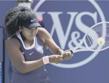  ??  ?? 0 Naomi Osaka plays a return during her quarter-final win over Anett Kontaveit in New York.