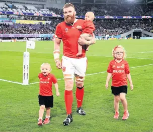  ?? Adam Davy/PA Wire ?? Jake Ball with his children after Wales’s 2019 World Cup bronze medal match in Tokyo.
