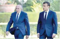  ?? — AFP file photo ?? French President Emmanuel Macron (R) and French Interior Minister Gerard Collomb.