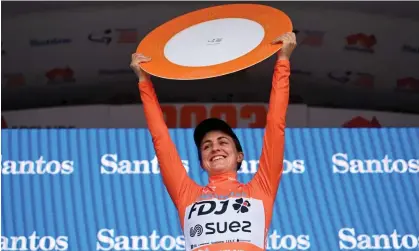  ?? ?? Grace Brown of Team FDJ-Suez celebrates on the podium after winning the Women's Tour Down Under. Photograph: Tim de Waele/Getty Images