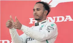  ?? AFP ?? Mercedes’ Lewis Hamilton celebrates his win at the Japanese Grand Prix on Sunday.