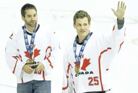  ?? CLIFFORD SKARSTEDT/EXAMINER FILES ?? Team Canada World Indoor Lacrosse champion players Shawn Evans, left, and Brad Self were honoured by the Peterborou­gh Petes on Oct. 3, 2015 at the Memorial Centre.