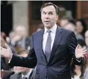  ?? ADRIAN WYLD/THE CANADIAN PRESS ?? Finance Minister Bill Morneau’s fiscal statement last week was upbeat. The outlook this week looks less so.
