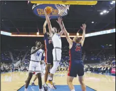  ?? Associated Press ?? UCLA guard Jaime Jaquez Jr. (24) shoots over Pepperdine forward Jan Zidek (31) during the first half on Wednesday in Los Angeles. The No. 19 Bruins won 100-53.