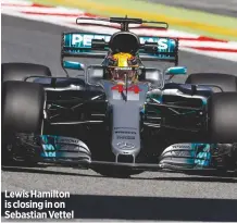  ??  ?? Lewis Hamilton is closing in on Sebastian Vettel