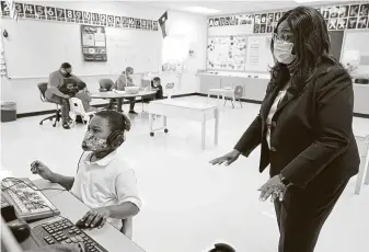  ?? Melissa Phillip / Staff photograph­er ?? Grenita Lathan, Houston ISD interim superinten­dent, visits a classroom at Atherton Elementary School last month. Lathan took the job in 2018 after the abrupt departure of Richard Carranza.