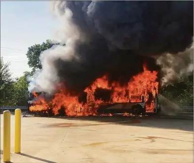  ?? Hamden Fire Department / Contribute­d photo ?? Officials said a lithium battery sparked a CTtransit bus fire in Hamden Saturday when temperatur­es soared to around 100 degrees.