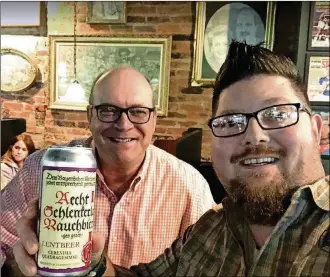  ?? CONTRIBUTE­D PHOTOS ?? Del Hall (right) enjoys a beer with “Bengal Jim” Foster.