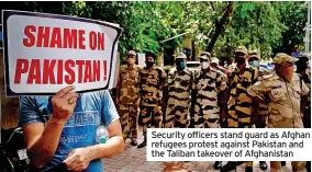  ??  ?? Security officers stand guard as Afghan refugees protest against Pakistan and the Taliban takeover of Afghanista­n