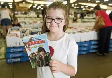  ??  ?? Seven-year-old Amelia Mallet had a list of books she was looking forward to reading at the Chronicle Lifeline Bookfest.