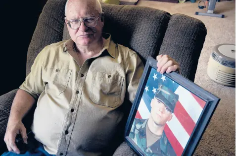  ??  ?? Donn Edmunds, a 25-year U.S. Army veteran, sits for a portrait Sept 1 in his living room in Cheyenne, Wyo. Edmunds’ son, Army Ranger Spc. Jonn Edmunds, was among the first U.S. casualties in the Afghanista­n war. THOMAS PEIPERT/AP