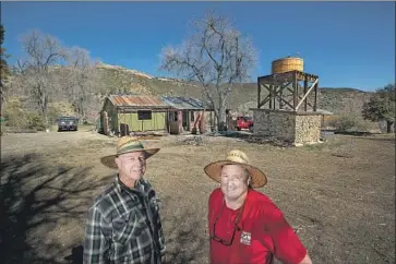  ??  ?? MIKE DAWSON, right, and his father-in-law, Dudley Zoll, 76, recently bought a cottage in Ojai. Dawson, 60, calls the wilderness retreat a place where people can “have a beer and enjoy themselves and listen to the wind.”