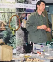  ?? Photograph­s: Lynda Syed. ?? Dan Griffiths on the ACT stall, sharing a taste of the outdoors.