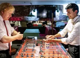  ??  ?? Hand washing: The PM and Chancellor at Pizza Pilgrims in East London yesterday. Restaurant­s can reopen on July 4