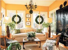  ?? GORDON BEALL/AP ?? This sunroom designed by Josh Hildreth has a light-colored rug and citrus trees that add a fresh scent to the space.