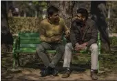  ?? ALTAF QADRI — THE ASSOCIATED PRESS ?? Indian gay couple Utkarsh Saxena, left, and Ananya Kotia, chat inside a public park in New Delhi, India, on Jan. 18.