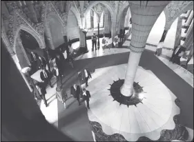  ?? CP PHOTO ?? King Philippe and Queen Mathilde of Belgium walk along a red carpet in Rotunda with Deputy Speaker of the House of Commons Bruce Stanton. the