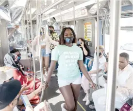  ?? PAT NABONG/SUN-TIMES PHOTOS ?? My Block, My Hood, My City models, including Chantel Embrey (bottom photo), walk a Red Line train runway Saturday to show off the organizati­on’s summer clothing line and raise funds for its programs.