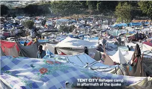  ??  ?? TENT CITY Refugee camp in aftermath of the quake