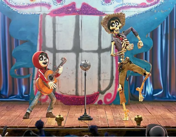  ??  ?? Gabriel Garcia Bernal’s Hector helps young Miguel (Anthony Gonzalez) navigate the land of the dead in Pixar’s Coco.