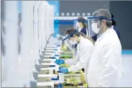  ??  ?? Medical students work at a Covid mass test centre at St Andrews University yesterday