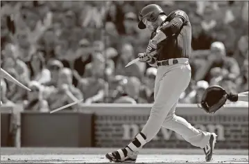  ?? Jim Young / The Associated Press ?? Milwaukee’s Ryan Braun breaks his bat during the first inning of Sunday’s game against the Chicago Cubs in Chicago.