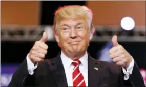  ?? ALEX BRANDON — THE ASSOCIATED PRESS FILE ?? In this file photo, President Donald Trump reacts before speaking at a rally at the Phoenix Convention Center in Phoenix. The Trump administra­tion is preparing to restore the flow of surplus military equipment to local law enforcemen­t agencies.