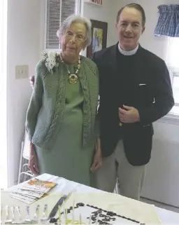  ?? BY LORAINE C. CHANNING ?? Elizabeth (Betty) Buntin, with the Rev. H. Miller Hunter, celebrated her 100th birthday with her Trinity Episcopal Church family. The centennial party was arranged by Margaret Baumgardne­r.