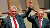  ?? PHOTO: AP ?? The outgoing president of Cuba, Raul Castro, right, keeps a firm grip on his replacemen­t, Miguel Diaz-Canel, at the National Assembly in Havana.