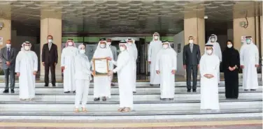  ??  ?? Saeed Mohammed Al Tayer receives the award from EFQM officials during a ceremony in Dubai.