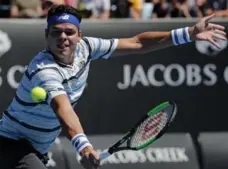  ?? VINCENT THIAN/THE ASSOCIATED PRESS ?? Canada’s Milos Raonic lost his first-round match to Slovakia’s Lukas Lacko, the 86th-ranked men’s player in the world.
